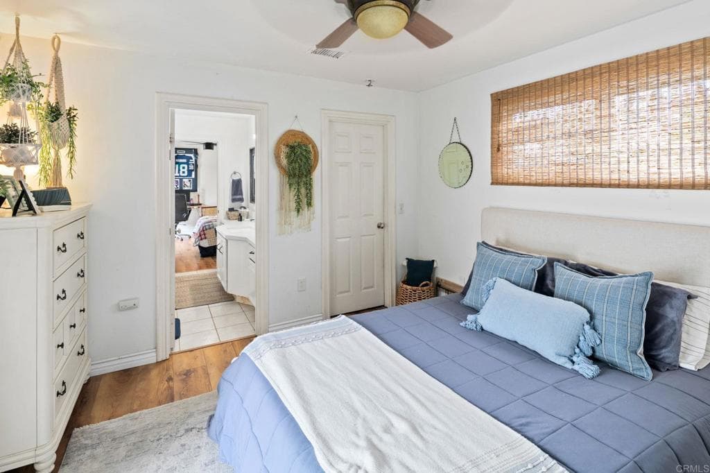 Primary bedroom opening to a spa-inspired ensuite (as-is)